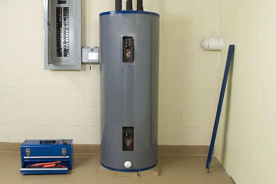 electric hot water heater in a storage room